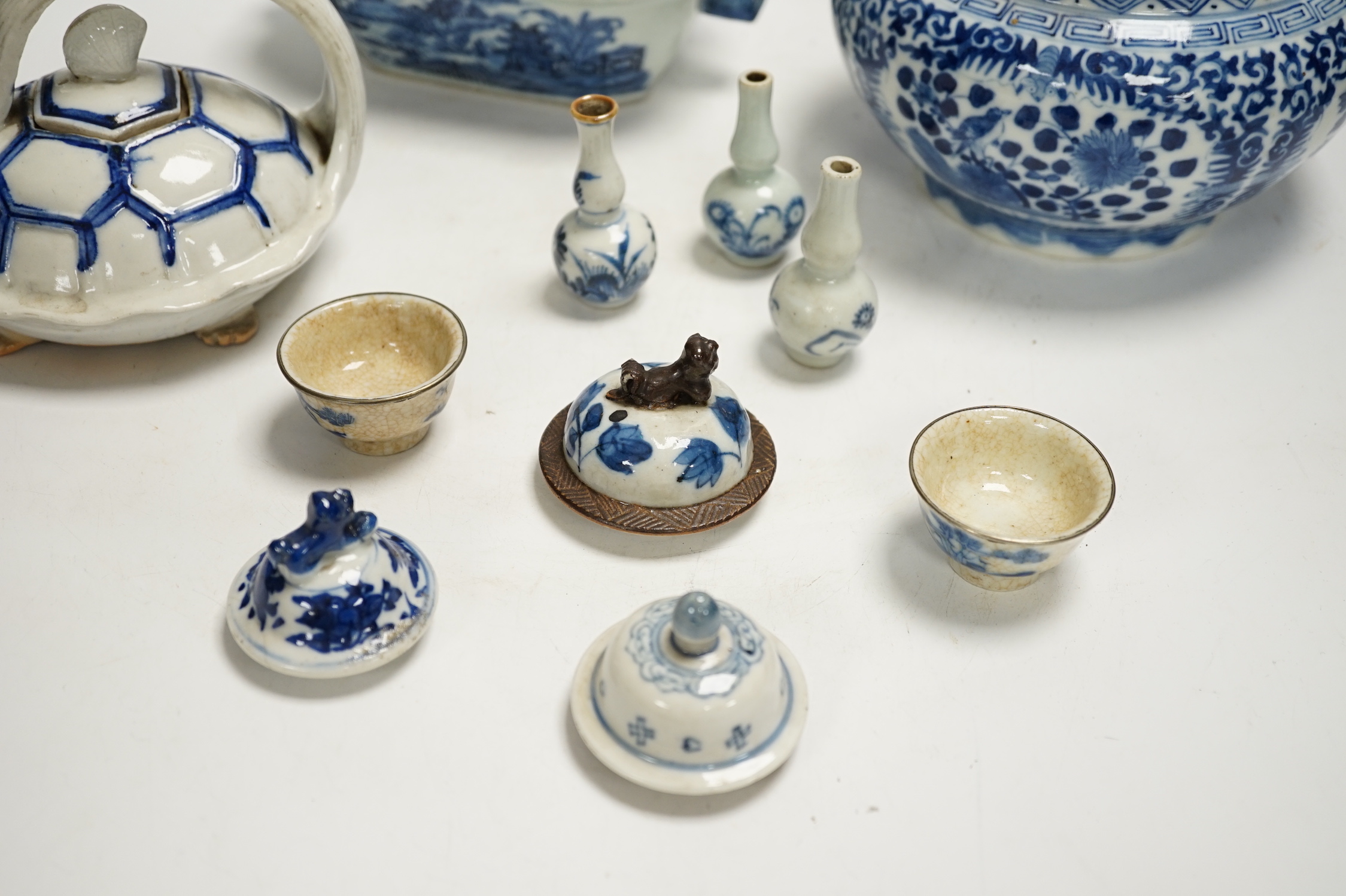 A Japanese Hirado ‘turtle’ teapot, an 18th century Chinese blue and white tureen and cover, an early 20th century jar and cover, teapot and various small vases, covers etc.